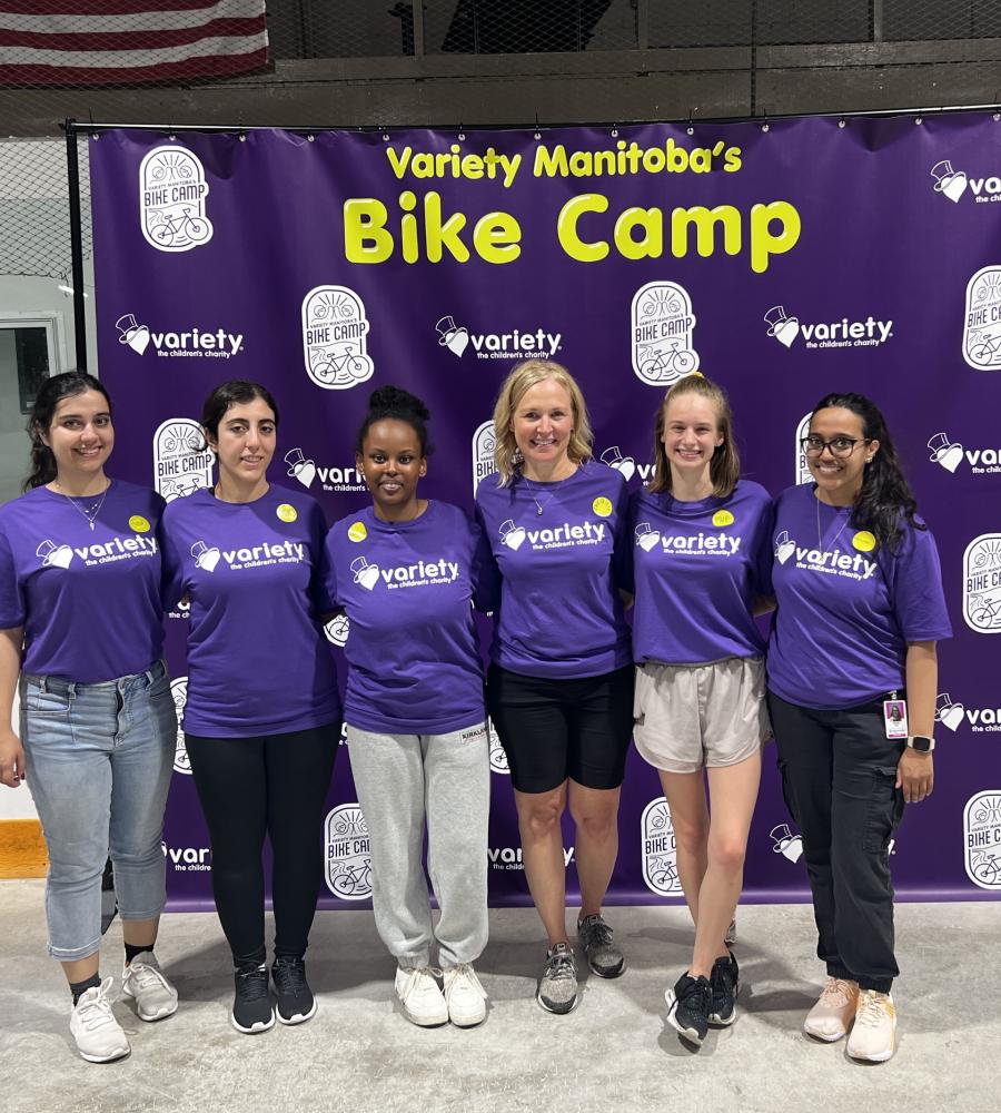 6 team members volunteering at Variety Childrens iCan bike program